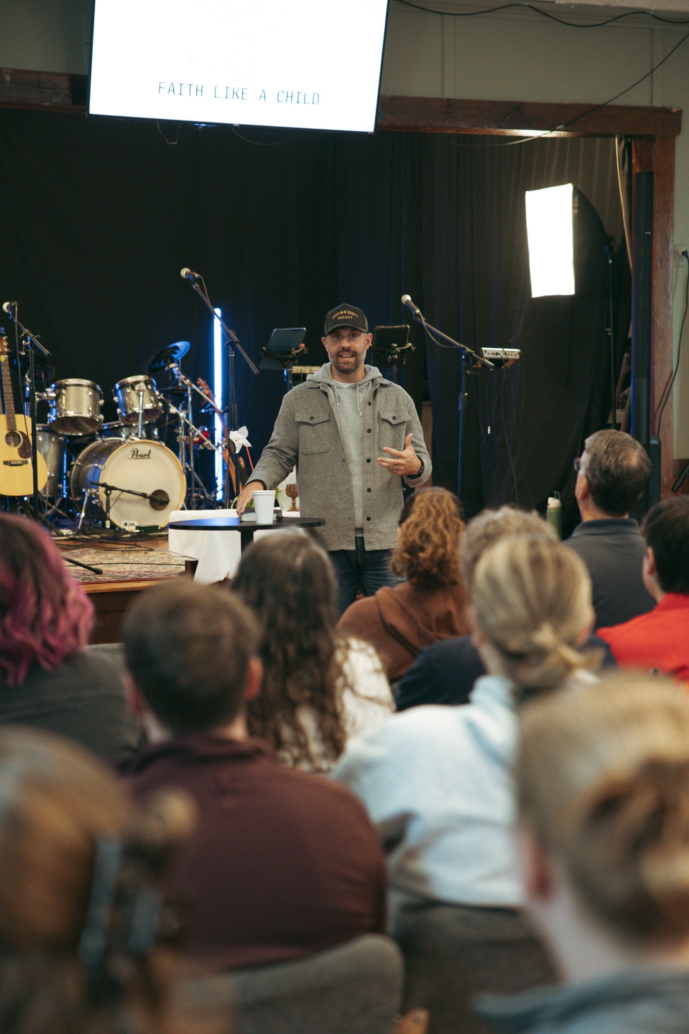 Danny speaking to the gathered community at The Well